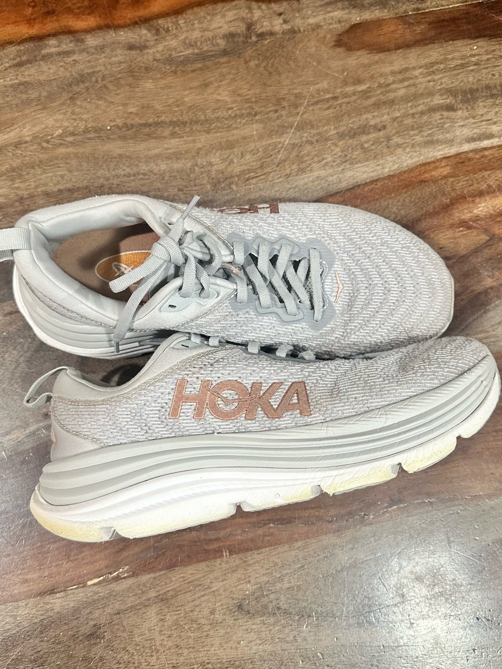 Hoka Light Gray Running Shoes with Rose Gold Logo